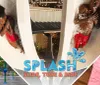 The image presents a collage promoting water-related activities including people going down water slides and enjoying a splash pad complemented by an inviting image of an ice cream with the words SPLASH Slide Tube  Ride superimposed on it