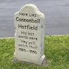 The image shows a humorous mock grave marker for 