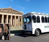 A trolley-style bus marked Music City BrewHop is parked in front of a building with classical Greek architecture