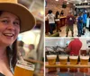 A smiling person with a hat gives a peace sign while holding a glass of beer in a lively indoor setting