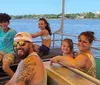 A smiling family of five is enjoying a sunny boat ride with a scenic water view in the background