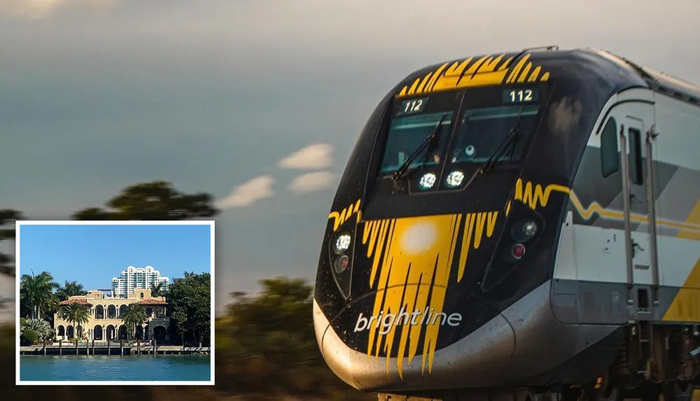 A high-speed train with distinctive yellow and black markings travels through a natural landscape during what appears to be the golden hour of sunlight