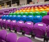 Soccer players are walking onto a stadium with purple seating and the word ORLANDO prominently displayed in the background