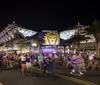 Soccer players are walking onto a stadium with purple seating and the word ORLANDO prominently displayed in the background