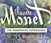 Several people are observing an immersive Monet art experience with colorful abstract projections in the background