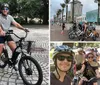 Two people are smiling for a photo while sitting on rental bicycles in an outdoor setting with cobblestone pavement