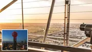 The image shows a view from a tower overlooking a cityscape at sunset, with a telescope in the foreground and an inset image of a tower illuminated at night.