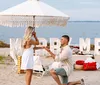 The image is a collage of six beach-themed photos including scenes of a woman with an American flag a marriage proposal a family portrait a surprised woman a group of bridesmaids and a couple enjoying a romantic moment