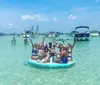 A group of smiling people is enjoying a sunny day on a boat with patriotic American flag-themed covers on the seats