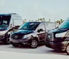 Three Mercedes-Benz vehicles are parked side by side with a palm tree-lined background showcasing a mix of luxury and utility