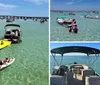 The image shows a lively water scene with people enjoying various activities on boats a floating mat and a paddleboard in clear turquoise waters