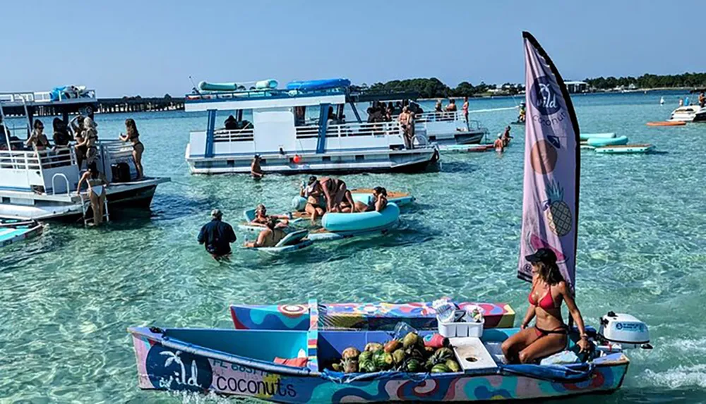 A tropical aquatic scene with multiple boats and people enjoying the clear blue water one boat upfront offers fresh coconuts to visitors