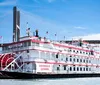 The image features the riverboat Georgia Queen with a traditional paddlewheel design sailing under a modern suspension bridge and theres a small inset picture showing a classic Southern meal