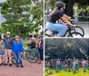 A group of people wearing helmets is gathered with their bicycles in a park surrounded by trees and a building in the background