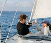 Two people are enjoying drinks while sailing on a boat