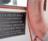 A boat labeled PILOT associated with the Maritime Museum of San Diego is carrying people on the water