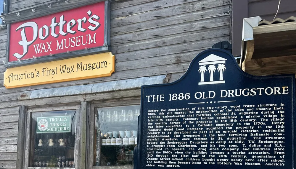 The image shows the exterior of Potters Wax Museum noted as Americas first wax museum alongside a historical marker for The 1886 Old Drugstore