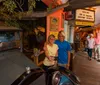 A couple is taking a selfie in front of an antique car inside Gator Bobs Old St Augustine History Museum