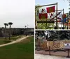 The image shows a partially constructed wooden ship frame in an outdoor setting surrounded by fencing and flags