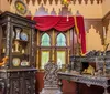 The image depicts an intricately designed multi-level interior space inspired by Middle Eastern architecture featuring arched doorways ornate columns decorative lanterns and vibrant colored accents