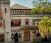 The image depicts an intricately designed multi-level interior space inspired by Middle Eastern architecture featuring arched doorways ornate columns decorative lanterns and vibrant colored accents