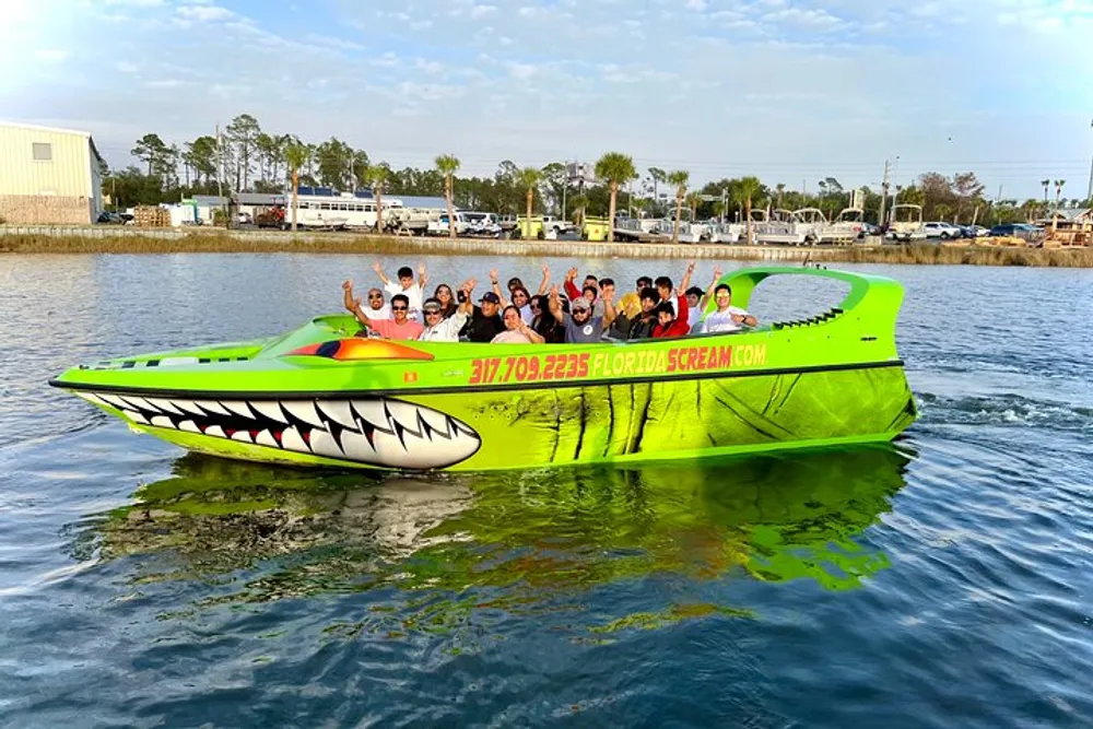 A group of people is enjoying a ride on a vibrant green speedboat with shark teeth graphics painted on the bow