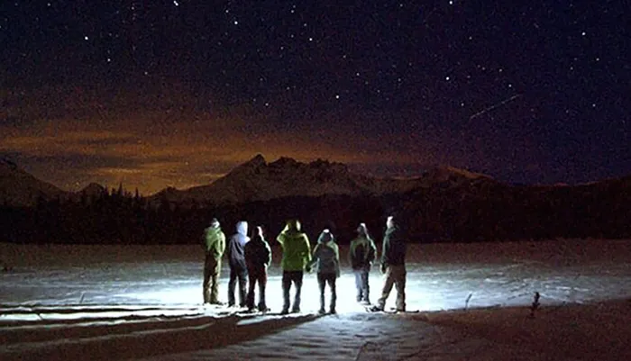 Moonlight Snowshoe Tour Under a Starry Sky Photo