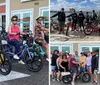 Four people are smiling and posing with colorful electric bikes in front of a bike rental shop