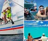 Two people wearing snorkeling gear are jumping off a sailboat into the sea while others watch