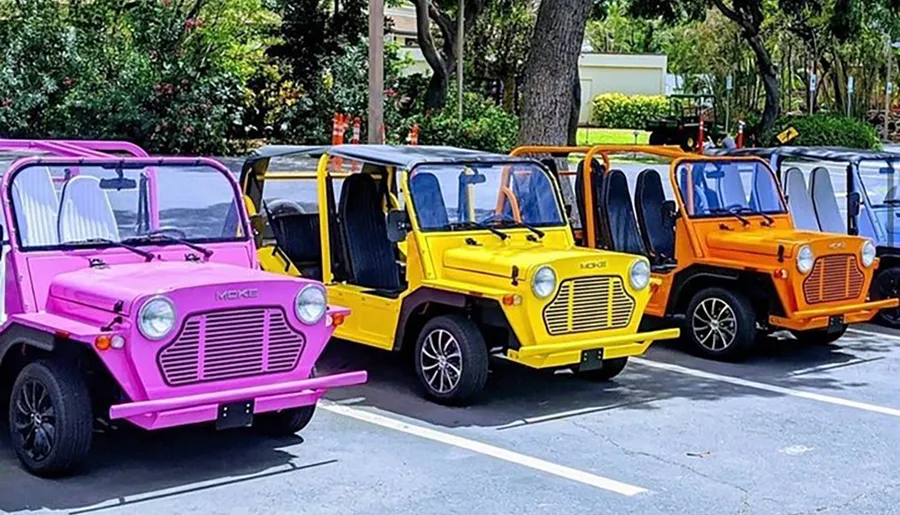 A row of colorful, retro-styled Moke vehicles parked side by side.