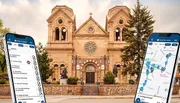 A pair of smartphones displaying a tour guide application are superimposed in the foreground of an image featuring a historic church with twin bell towers.