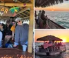 A group of people enjoys a scenic sunset from a thatched-roof pontoon boat flying the American flag on the ocean
