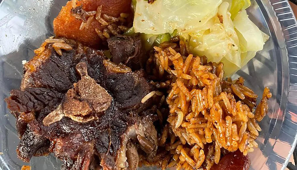 The image shows a plate containing rice beef cooked cabbage and what appears to be a slice of plantain arranged in a takeout container