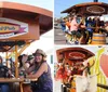 A group of people is joyfully riding a pedal-powered bar on wheels down a street