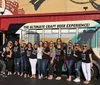 A colorfully wrapped Brew Bus is parked outside the Cigar City Brewing facility advertising brewery tours and various private events