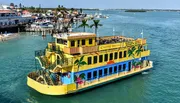 A brightly painted paddleboat with the name 