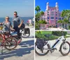 Three people are standing with their bicycles on a sunny day near a beach seemingly enjoying a break from cycling