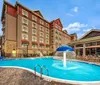 Outdoor Swimming Pool of Black Fox Lodge Pigeon Forge Tapestry Collection by Hilton
