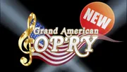 The image shows a stylized golden treble clef against a backdrop of the American flag with the words 