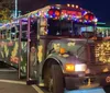 A child in a Santa hat looks out a window at a brightly lit Ferris wheel at night with a quote saying BEST experience in Pigeon Forge attributed to Angela