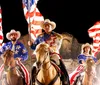 The image features three people in cowboy attire riding horses and holding American flags with an inset of a hearty meal and the text Great show Great food with a Yelp logo