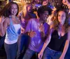 A group of joyful people are dancing and having fun together at a bar or club