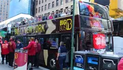 A double-decker tour bus labeled 