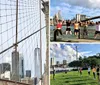 A group of five people are posing for a photo on the Brooklyn Bridge with the New York City skyline in the background