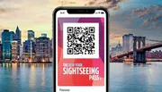 The image showcases a smartphone displaying a QR code for the New York Sightseeing Pass, superimposed on a scenic view of the New York City skyline and the Brooklyn Bridge during twilight.