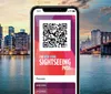 A smartphone displays a New York Sightseeing Pass with a QR code on the screen superimposed on a background featuring a city skyline at dusk