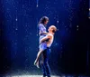 The image displays a colorful watercolor artwork of a couple embracing alongside the title The Notebook The Musical