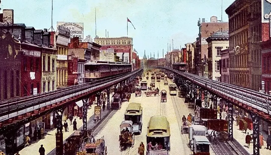 The image depicts a bustling early 20th-century street scene with an elevated train track, horse-drawn carriages, and vintage automobiles, showcasing a vivid snapshot of urban life during that era.