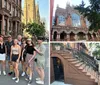 A group of smiling people poses for a photo on the sidewalk in front of a row of brownstone buildings indicative of an urban residential neighborhood