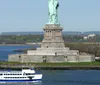 The image shows an aerial view of the Statue of Liberty with a backdrop of the Manhattan skyline and surrounding waters